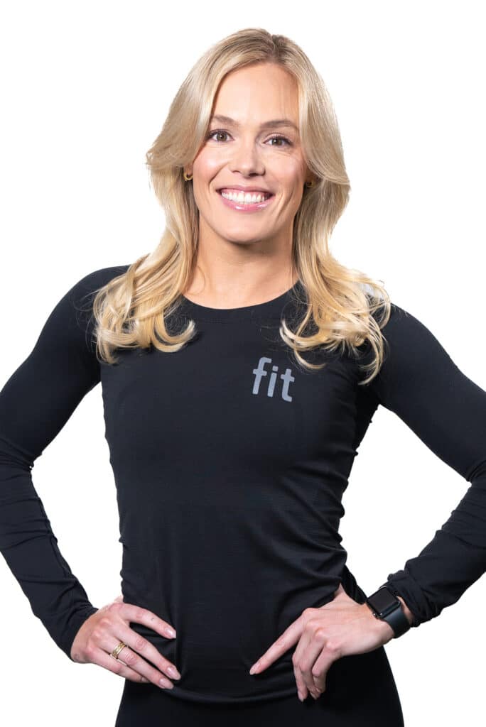 A woman with her hands on her hips.