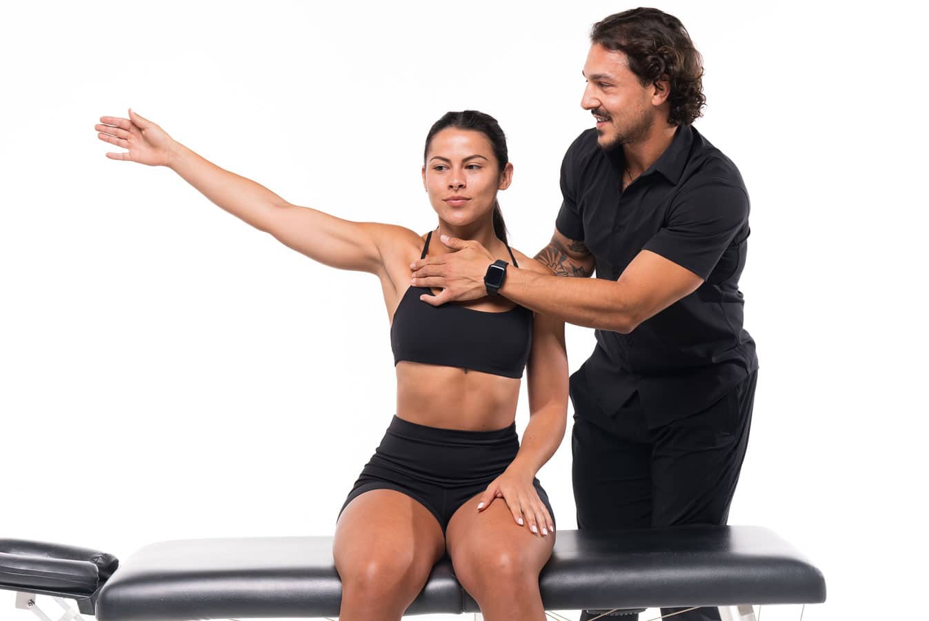 A woman is being helped by a physical therapist.