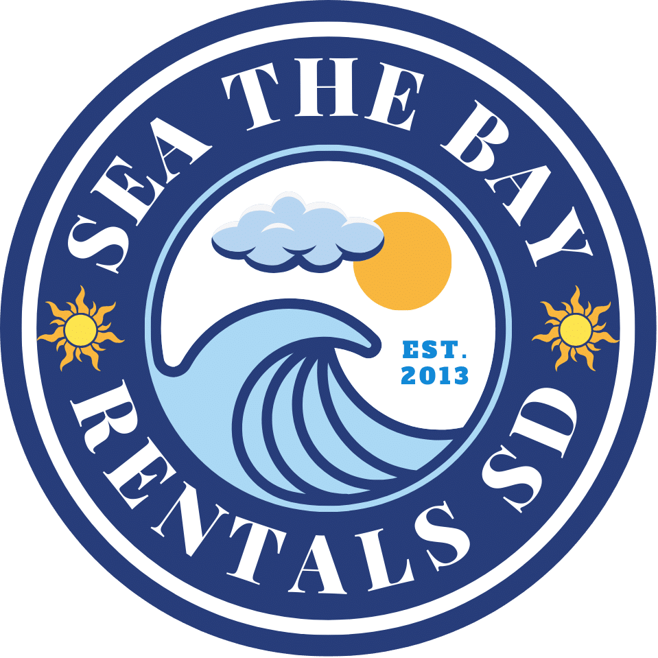 Circular logo for Sea The Bay Rentals SD. Features waves, a sun, clouds, and text "Est. 2013" surrounded by blue border with sun icons.